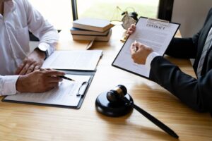 Lawyers or attorneys examining the statute of limitations in a consultation setting with male legal professionals and business clients, within tax and legal services firms.
