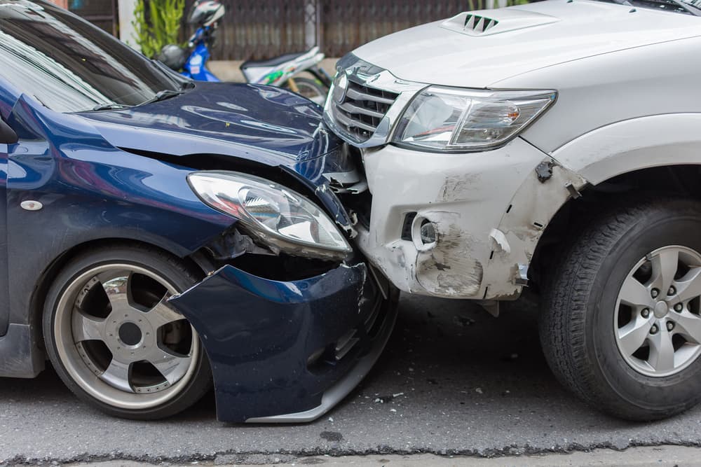City road collision: sedan vs. pickup. Both drivers are currently awaiting insurance assessments.